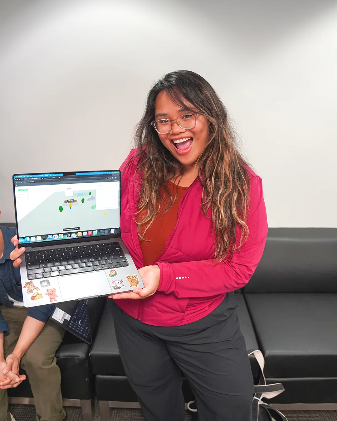 Charlene showing her winning Don't Die In Office project